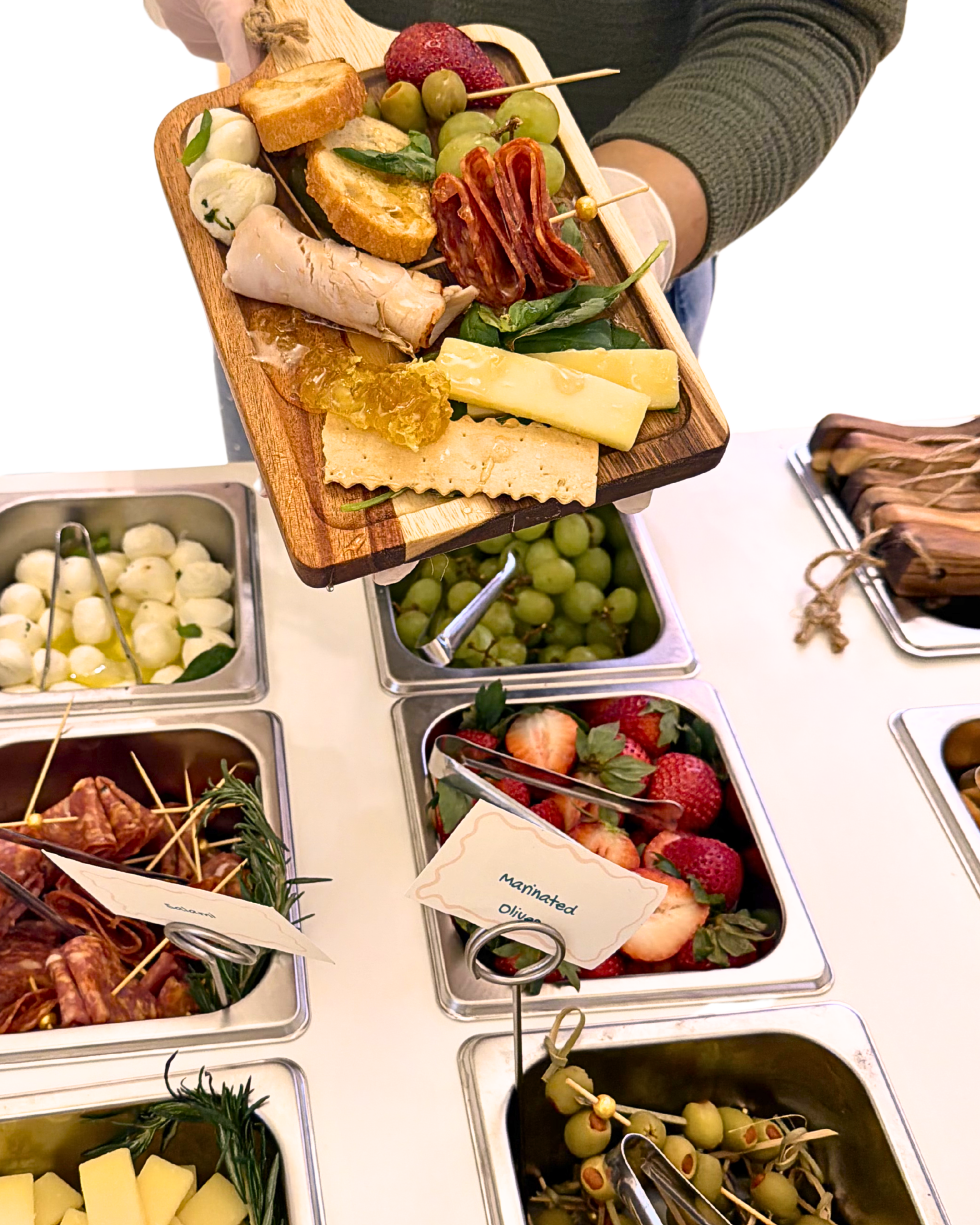 Styled charcuterie spread with artisan cheeses on the BiteHaus signature cart