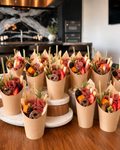 Individual grab-and-go charcuterie cups with artisan cheese, cured meats, and fruit