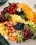 Fruit grazing platter with vibrant seasonal fruit by BiteHaus
